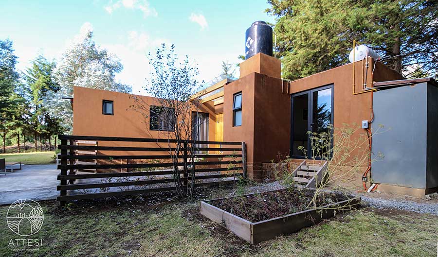Rustic terracotta building at Attesi Lodge
